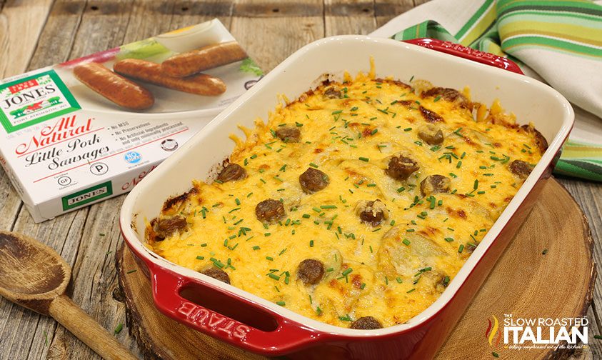 baked cheesy scalloped potatoes with sausage topped with fresh chives