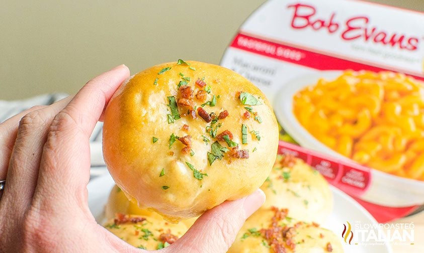 close up: holding a mac and cheese bacon bomb