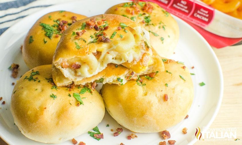 bacon mac and cheese bombs stacked on a plate