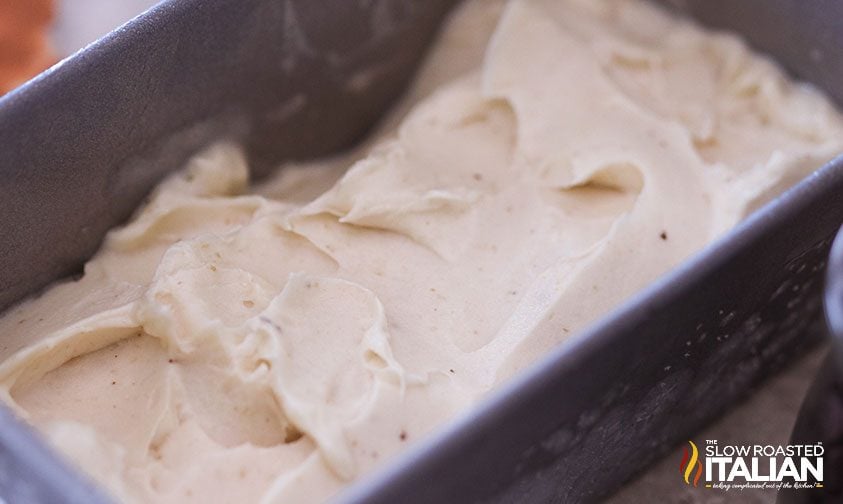 banana nut ice cream spread into a metal loaf pan