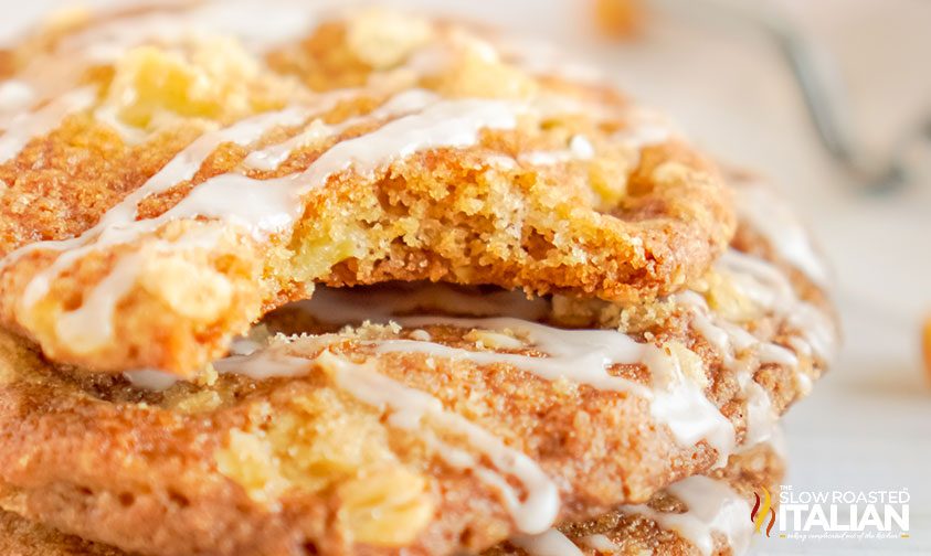 stacked apple cookies with one with a bite taken out of it