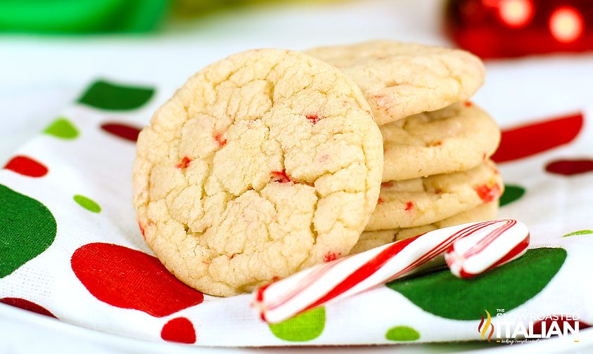 close up: stacked candy cane sugar cookies on a festive napkin