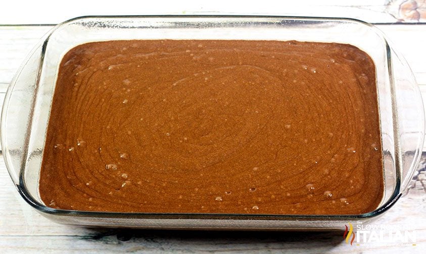 chocolate cake batter in glass 9x13 pan