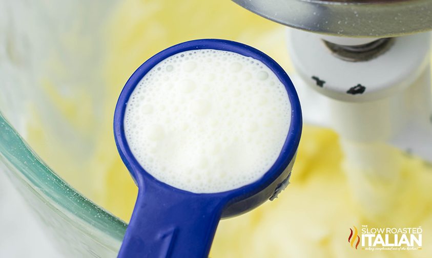 adding heavy cream to frosting in stand mixer