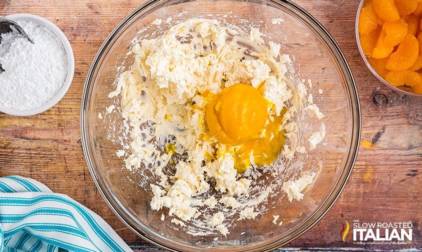 bowl with frozen orange juice concentrate and whipped cream cheese