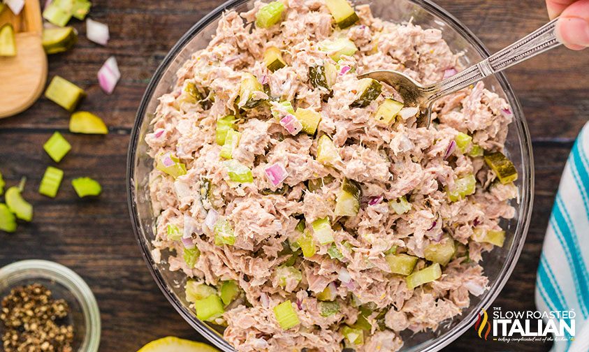 Tuna Salad Recipe ingredients mixed in a clear bowl