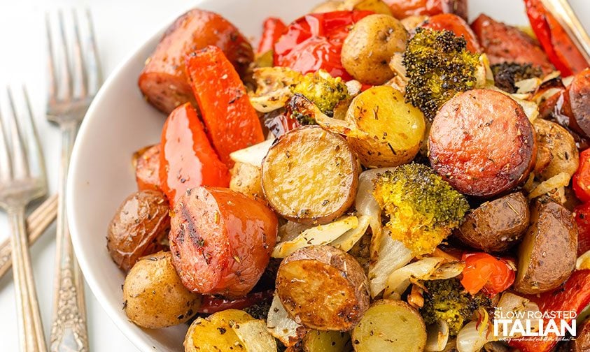 plateful of air fried sausage coins, baby potatoes, broccoli, carrots, and onion