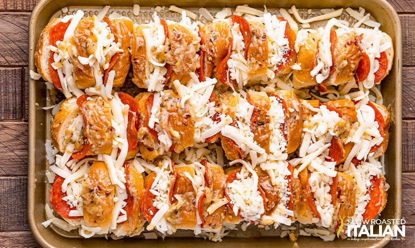 Hawaiian rolls stuffed with pepperoni and cheese, drizzled in seasoned butter