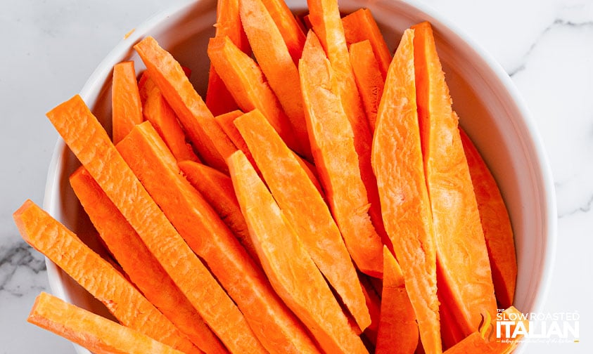 sliced sweet potatoes in a bowl.