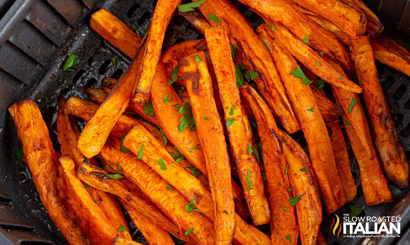 sweet potato fries in air fryer basket.