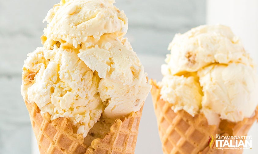 scoops of cheesecake ice cream in waffle cones