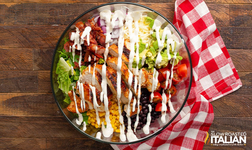 unmixed barbecue chicken salad drizzled with ranch