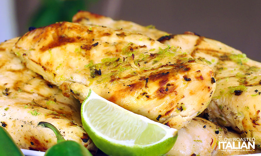 grilled tequila lime chicken with lime wedges