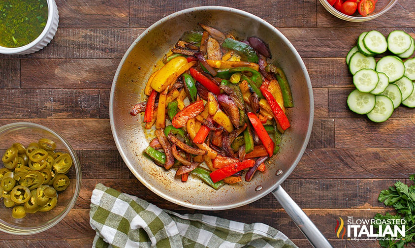 sauteed peppers and onions in a skillet