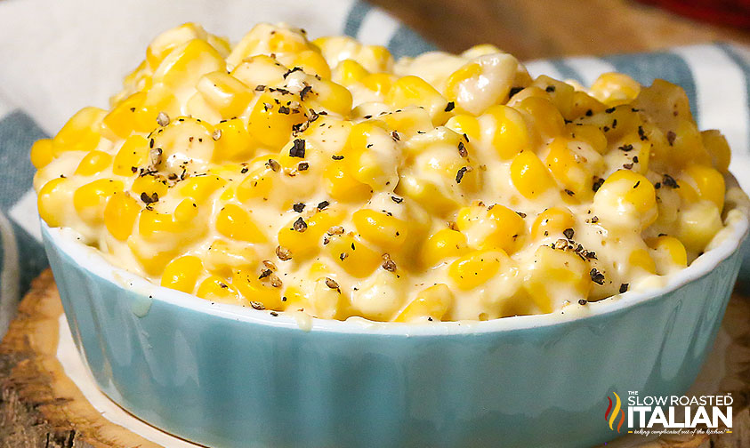 creamed corn with black pepper in blue dish