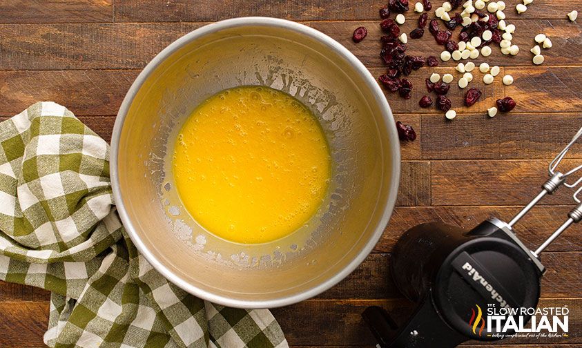 melted butter and eggs in mixing bowl