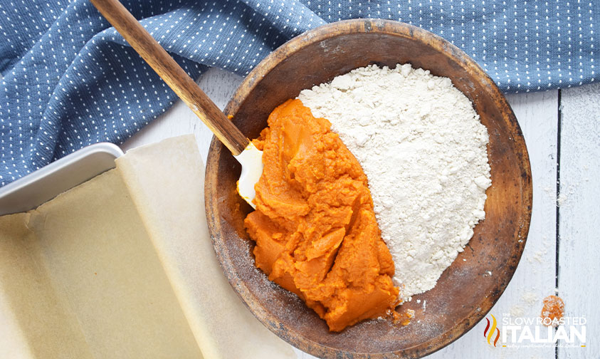 pumpkin puree and flour in mixing bowl