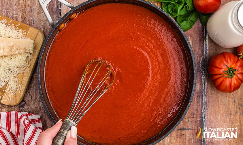 whisking penne alla vodka sauce