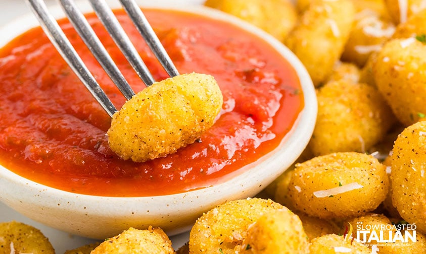air fried gnocchi dipped in red sauce