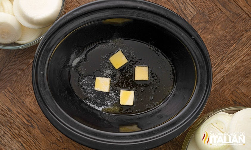 pats of melting butter in slow cooker