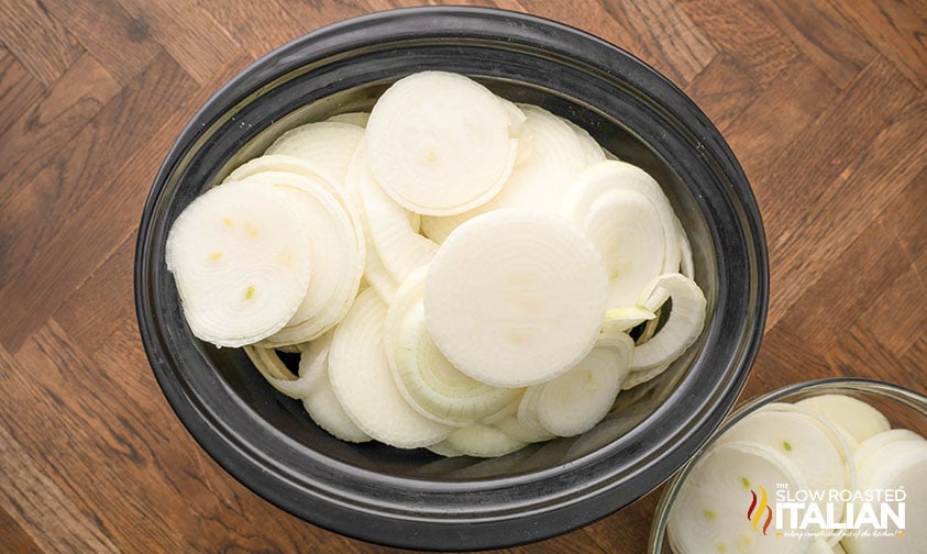 sliced onions added to slow cooker