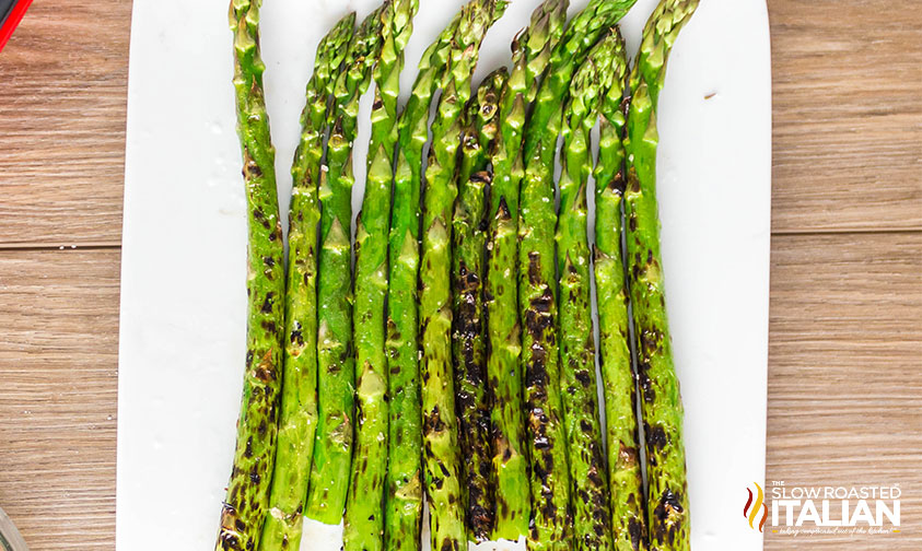 grilled asparagus on a white plate