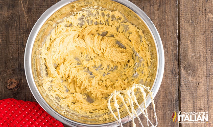 blending butter and brown sugar in a mixing bowl