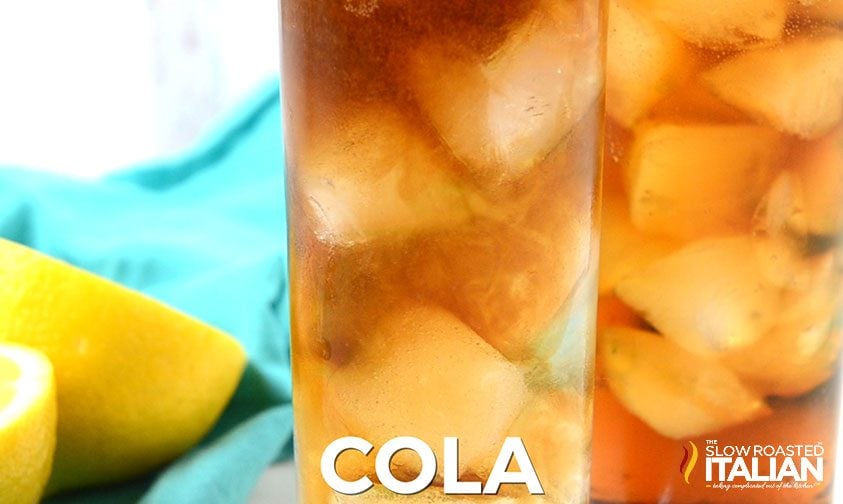 two glasses of long island ice tea, white text along bottom says cola