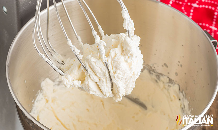 maple syrup whipped cream on a whisk