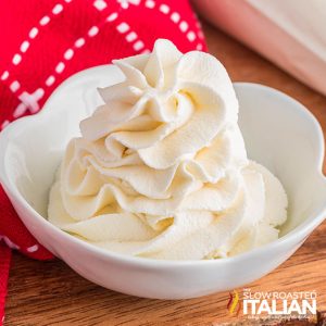 homemade maple whipped cream in a small white bowl