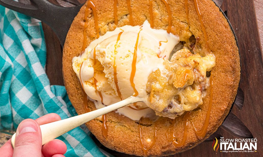 top view of a spoon of outback salted caramel cookie skillet