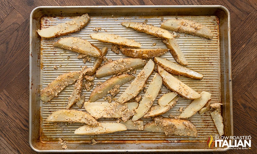 garlic fries on a baking sheet