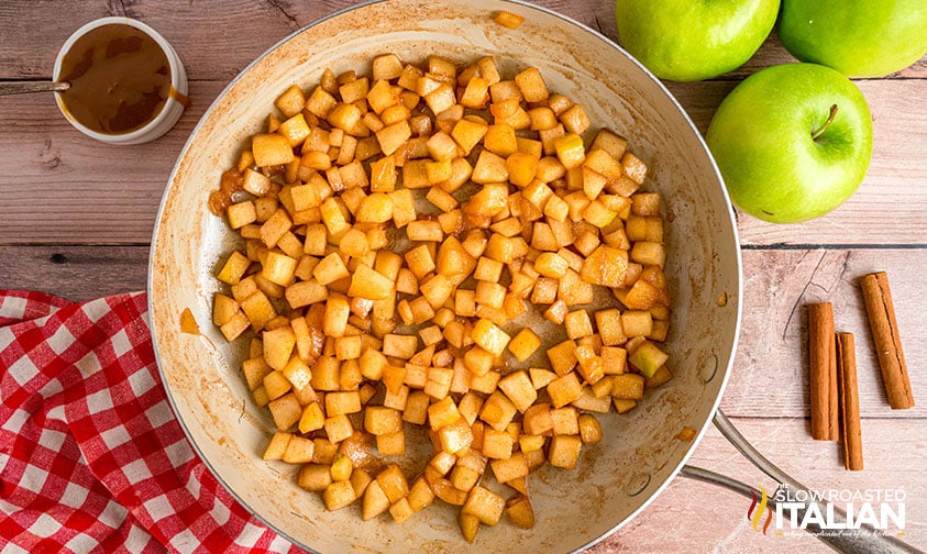 cooking apples in a sauce pan for taco bell empanadas