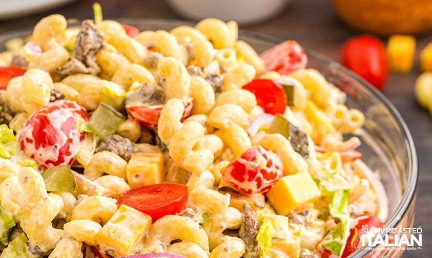 close up: creamy pasta salad with hamburger meat, cheese, and veggies
