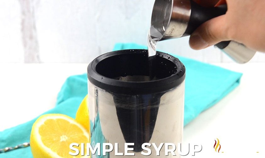 pouring clear liquid into cocktail shaker, white text along bottom says simple syrup