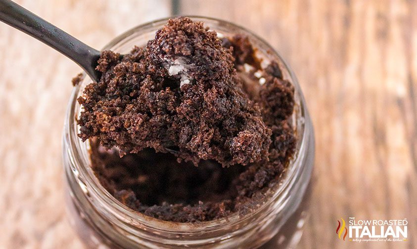 overhead closeup: scooping chocolate mug cake out of jar