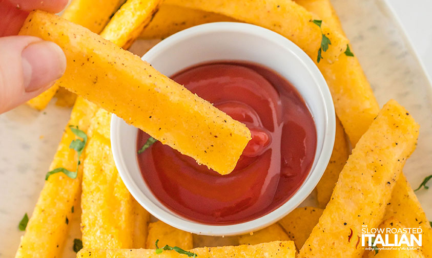 air fryer polenta fry dipped in ketchup