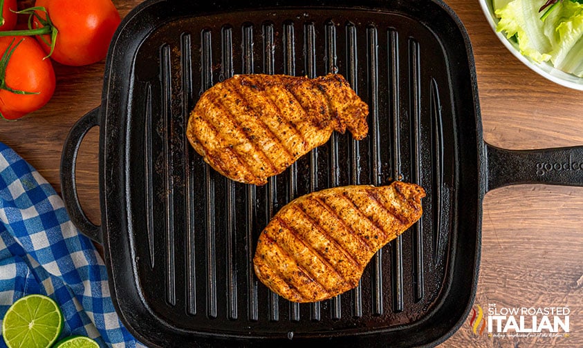 grilling chicken breasts in a grill pan