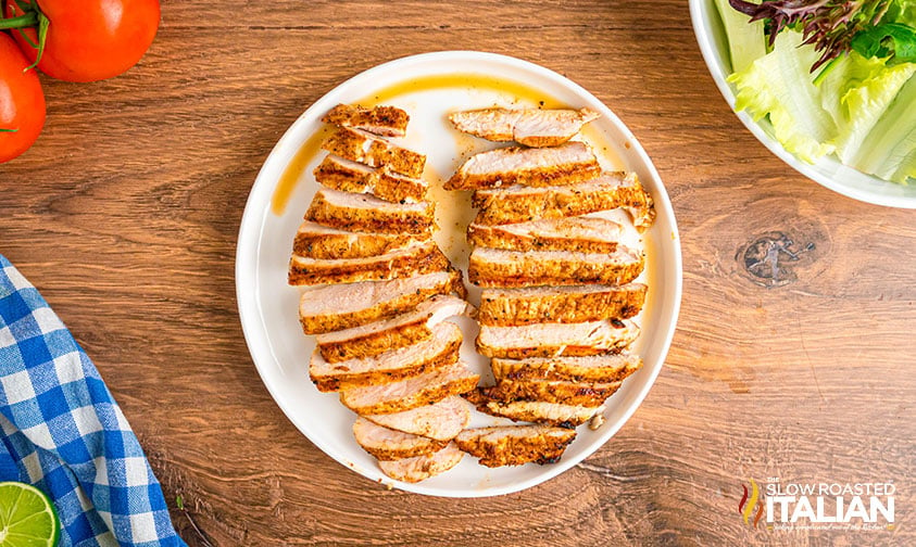 sliced chicken breasts on a plate