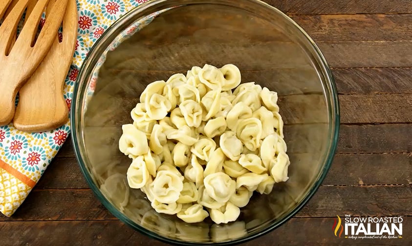 cooked tortellini in a large mixing bowl