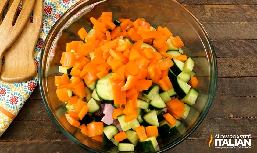 cucumber and orange bell pepper added to hawaiian pasta salad