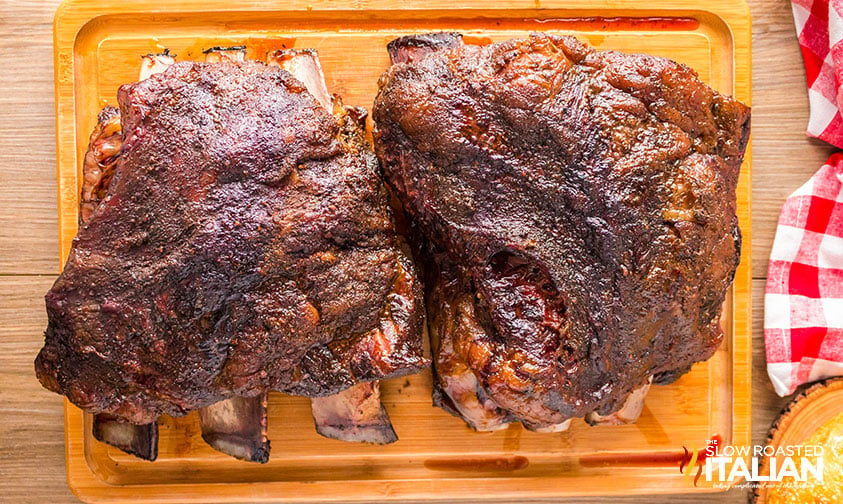 smoked beef short ribs on a wooden cutting board