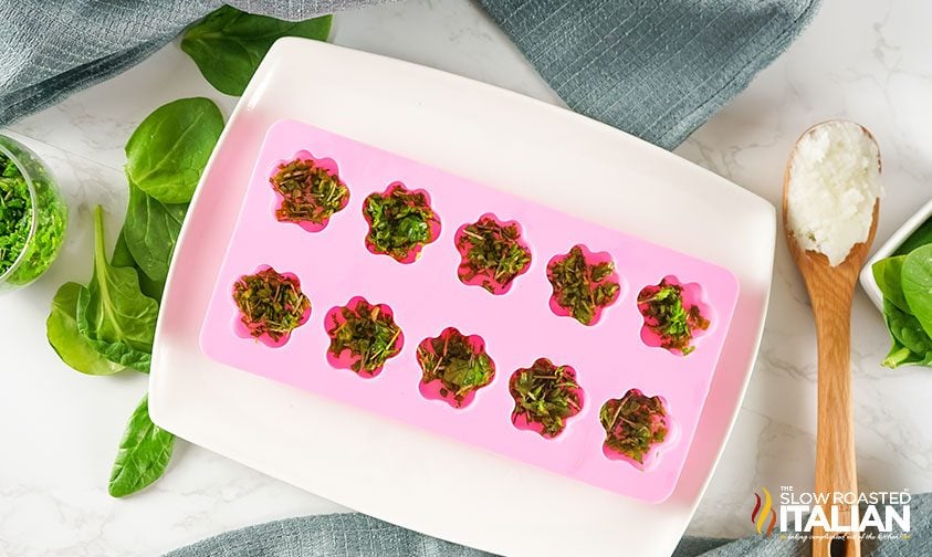 spinach rosemary dog treats in a pink paw print mold