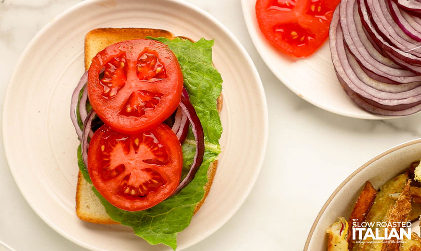 assembling a fried meatloaf sandwich