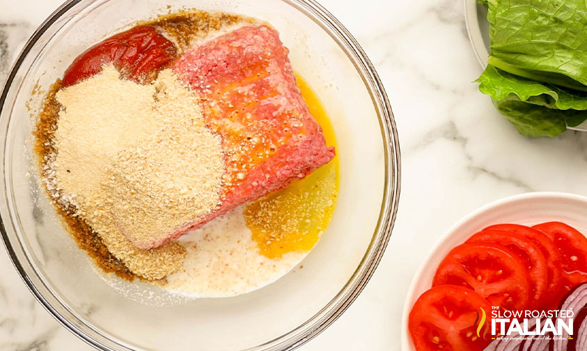 ingredients for meatloaf in a mixing bowl