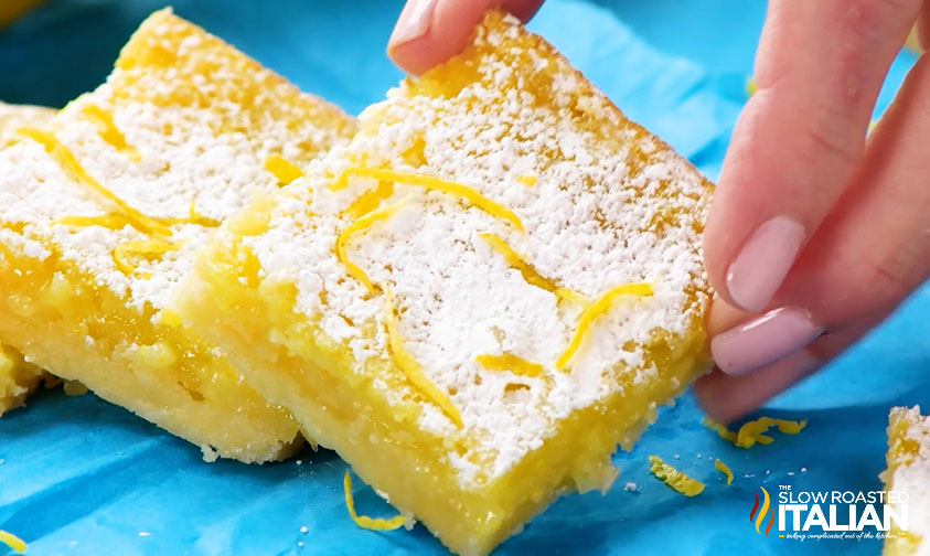 hand holding easy lemon squares