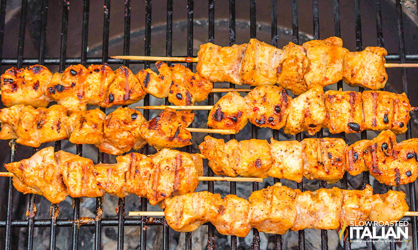 bang bang chicken skewers on a hot grill
