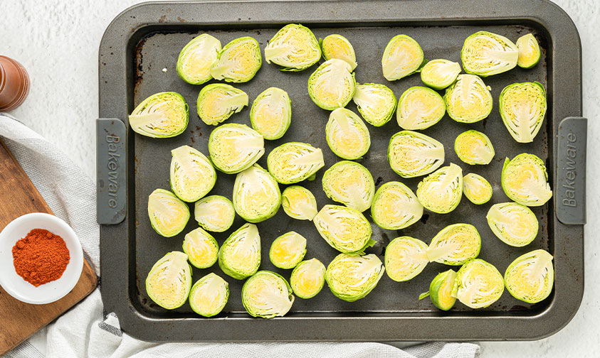 chopped brussel sprouts on a baking sheet