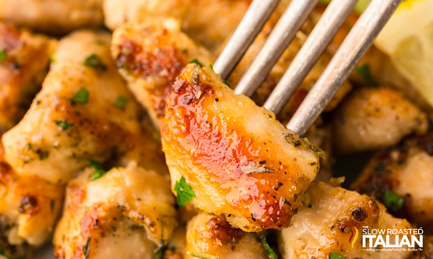 closeup of garlic butter chicken bites on a fork