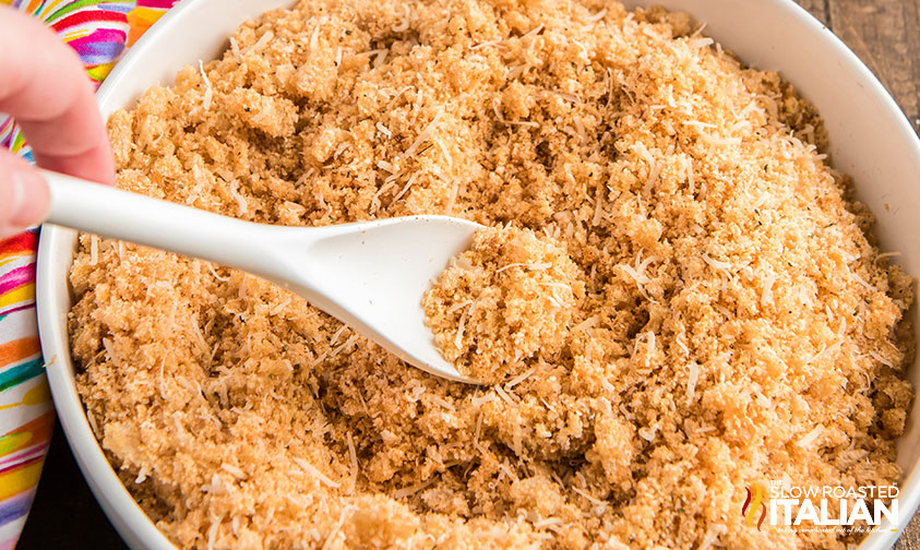 crushed pork rinds, seasoning and parmesan cheese in a mixing bowl